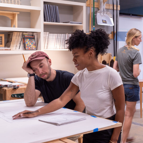 Student learning how to draft at Austin School of Furniture