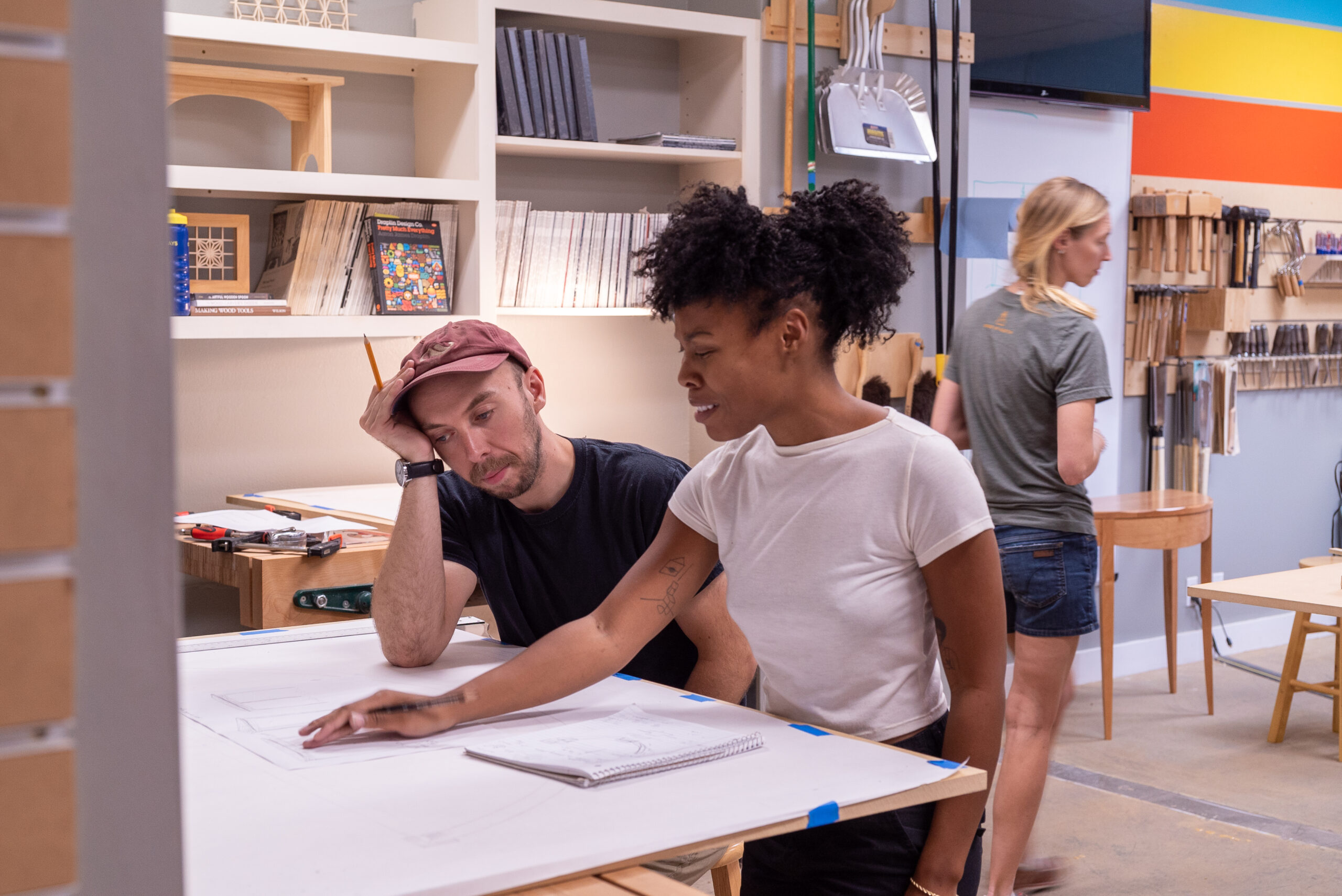 Student learning how to draft at Austin School of Furniture